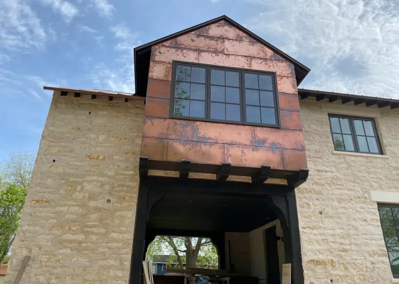 Copper metal panel facade on a stone building for Metal Roof Coating in Aiea