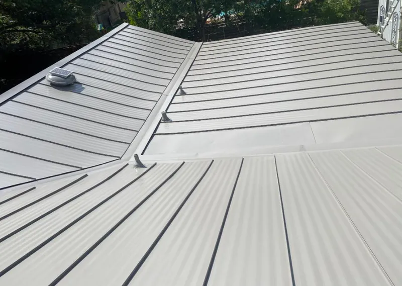 Solar attic fan installed on a metal roof for Roof Ventilation in Aiea